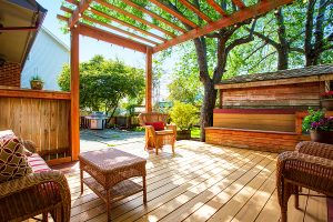 Pergola and deck in backyard.